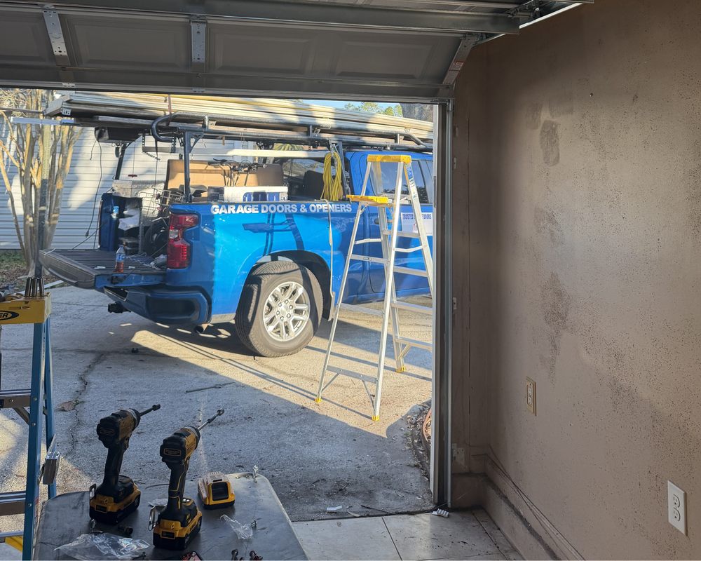 Garage door repair service in Jacksonville FL fixing springs and openers
